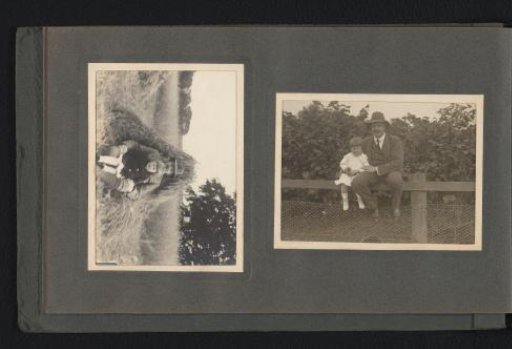 Hendrik Herman van den Berg with his son Carel on a field and a fence