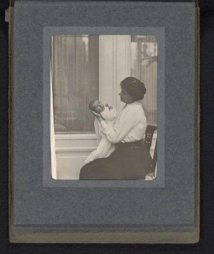 Caroline van den Berg with baby Frank in her arms