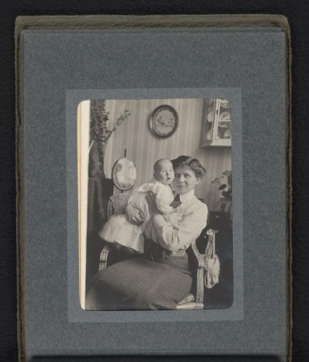 Caroline van den Berg with baby Frank in her arms