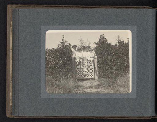 Two Women and Three Boys on a Fence, Left: Caroline and Cay van den Berg