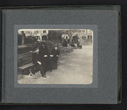 Carel and Frank van den Berg on toy horses in a park