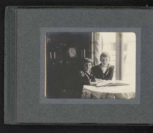 Carel and Frank van den Berg with a photo album
