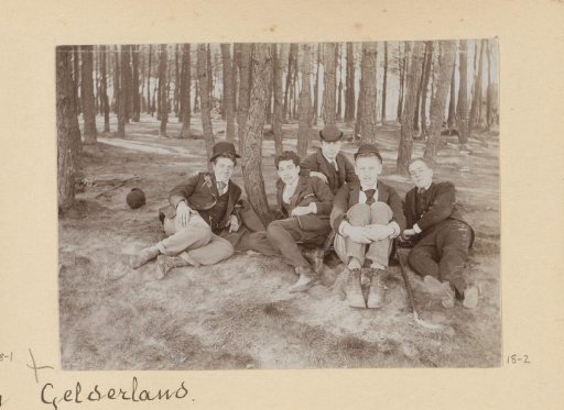 Walking party resting under a tree