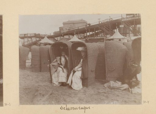 Three women in beach chairs on the beach of Scheveningen