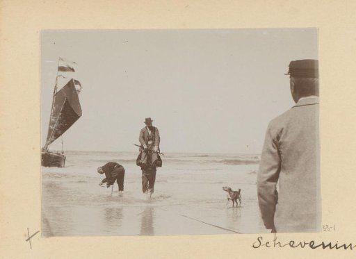 Man standing in the surf with another man on his shoulders