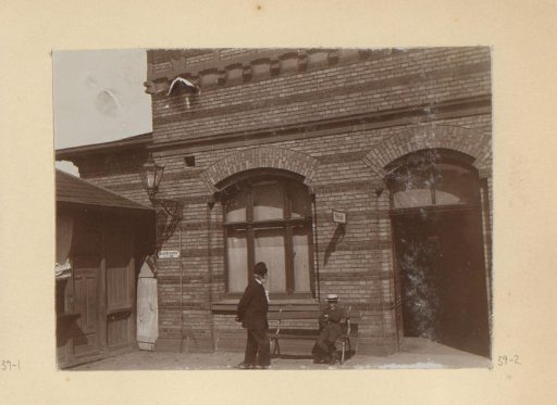 Two Men in Front of a Building