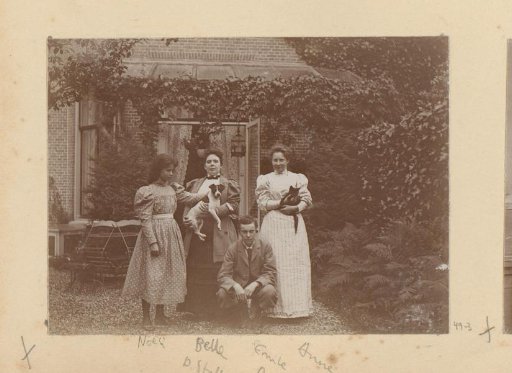 Group portrait in a garden with dog and cat
