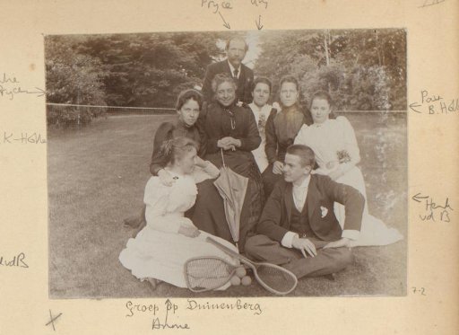 Group Portrait of a Company with Tennis Rackets in the Grass at Duinenberg