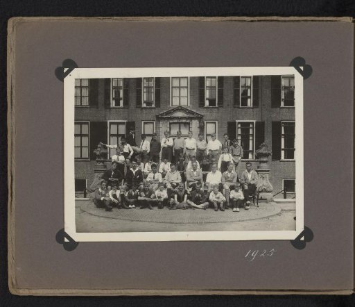 Group portrait of young men and boys seated before Hardenbroek Castle