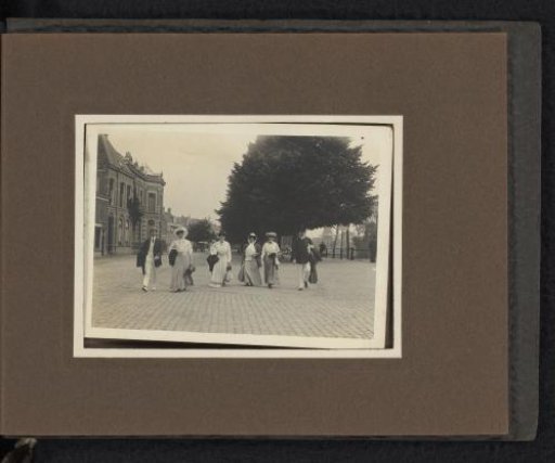 Group walking along a wide quay