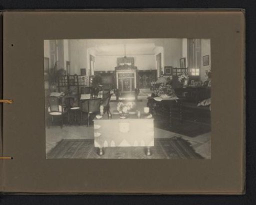 Interior of a room with various seating areas in the official residence of the Javasche Bank in Batavia