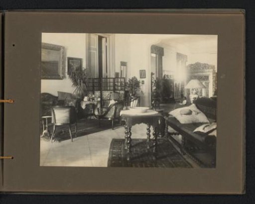 Interior of a room with various seating areas in the official residence of the Javasche Bank in Batavia