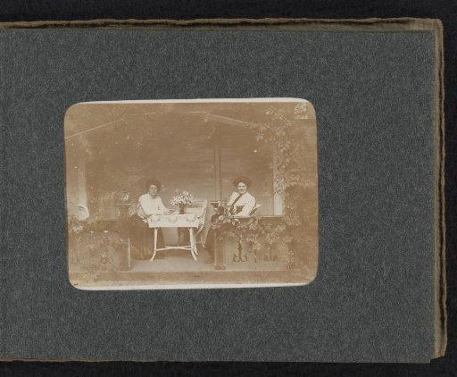 Two women, including Caroline van den Berg, on a veranda at Huis ter Heide