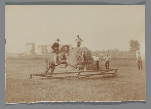 A Man Riding the Photographer's Horse Bobbie Taking an Obstacle on the Terrain behind the Rijksmuseum