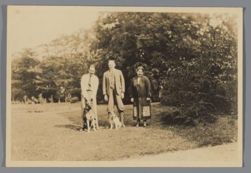 Karel Frederik van den Berg, his wife and an unknown person with two dogs in a field
