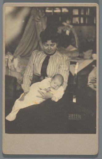 Portrait of A.C.M. Geertsema with a baby on his lap