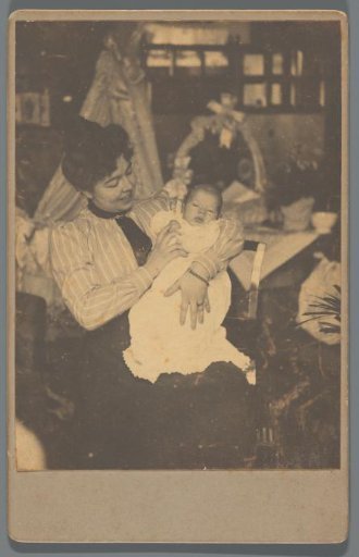 Portrait of A.C.M. Geertsema with a baby in her arms