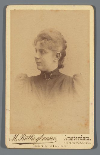 Studio portrait of Pauline van den Berg with hat and muff