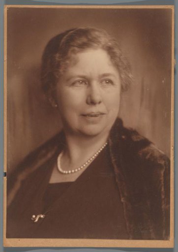 Portrait of Poppy Dunlop with a pearl necklace