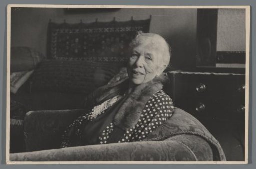 Poppy Dunlop in an armchair