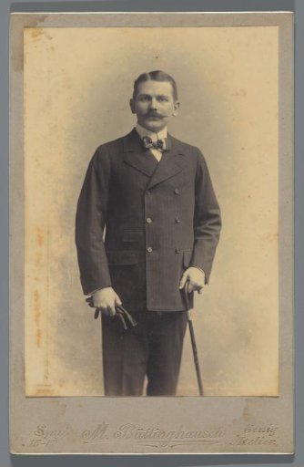 Studio portrait of Frans Alexander van den Berg with gloves and walking stick
