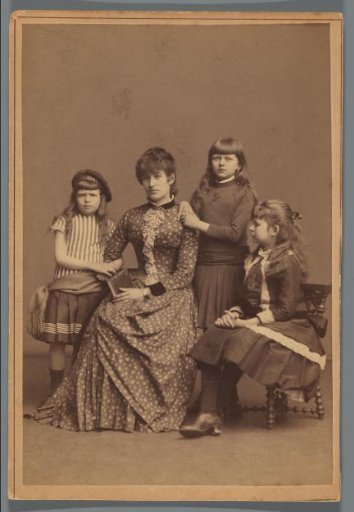 Studio portrait of Francine Schas with her three daughters
