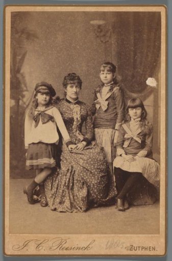 Studio portrait of Francine Schas with her three daughters