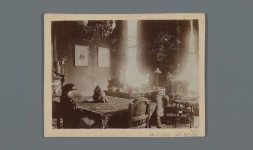 Portrait of Mr. Norbert Petrus van den Berg in his study at Turfmarkt 3, on the table a leg of a hippopotamus [illegible] of a