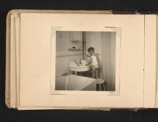 Norbert Peter van den Berg as a toddler by a washbasin in a bathroom