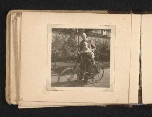 Man Holding Norbert Peter van den Berg as a Toddler on an Adult Bicycle