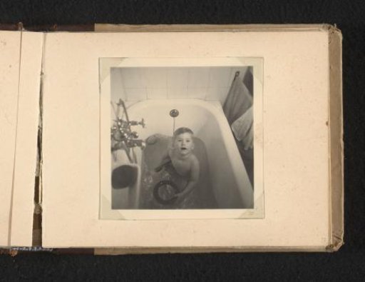 Norbert Peter van den Berg as a toddler in a bath, seen from above