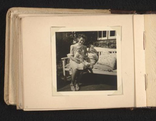 Maria Louise Van den Berg-Halbertsma with Children Norbert and Louise on a Bench in a Garden