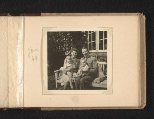 Maria Louise Van den Berg-Halbertsma and Frank Willem van den Berg with their children Norbert and Louise on a bench in a garden