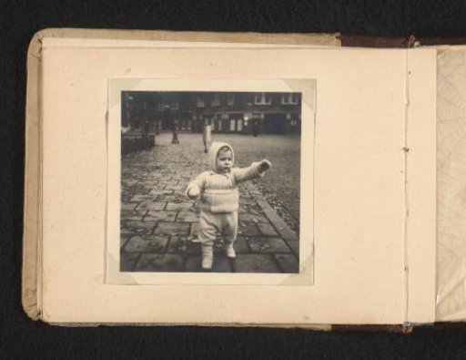 Norbert Peter van den Berg as a toddler in a suit of armor on the street