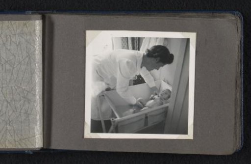 Maria Louise van den Berg-Halbertsma bathing her newborn son Norbert