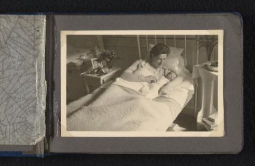 Maria Louise Van den Berg-Halbertsma in bed with her newborn son Norbert