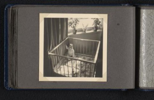 Norbert Peter van den Berg as a baby sitting in a crib
