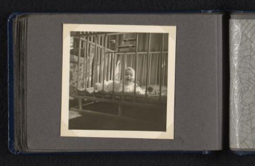 Norbert Peter van den Berg as a baby lying in a crib