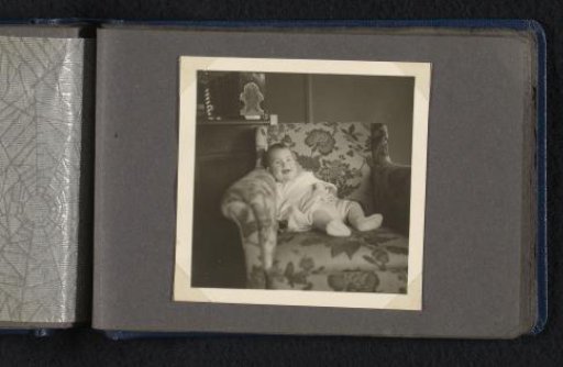 Laughing Norbert Peter van den Berg as a baby on an armchair