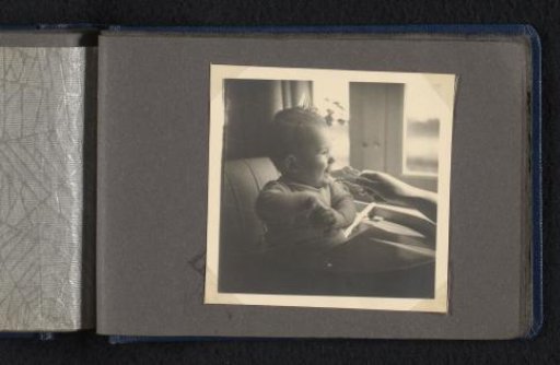 Norbert Peter van den Berg as a baby in a high chair