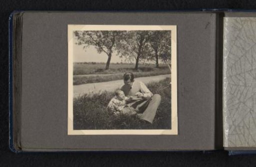 Frank Willem van den Berg with son Norbert as a baby sitting in the grass