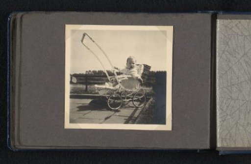 Norbert Peter van den Berg as a baby in a pram outdoors