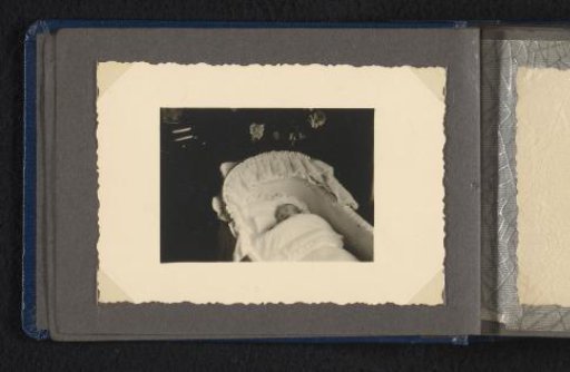 Norbert Peter van den Berg as a newborn baby in a cradle