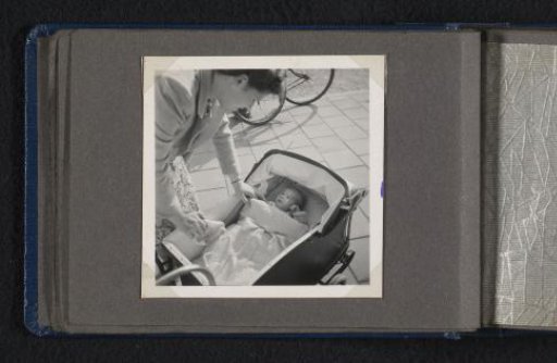 Maria Louise van den Berg-Halbertsma with newborn son Norbert in a pram on the street