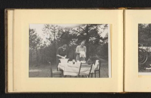 Woman and man washing dishes outdoors