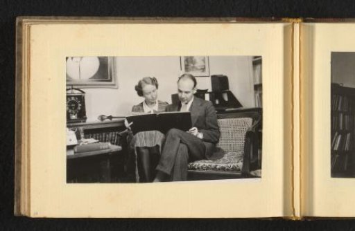 Woman and man viewing a book