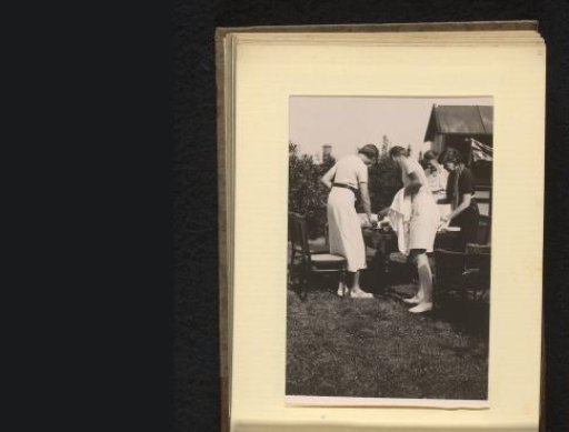 People on a Terrace in a Garden, During the Setting or Clearing of the Table