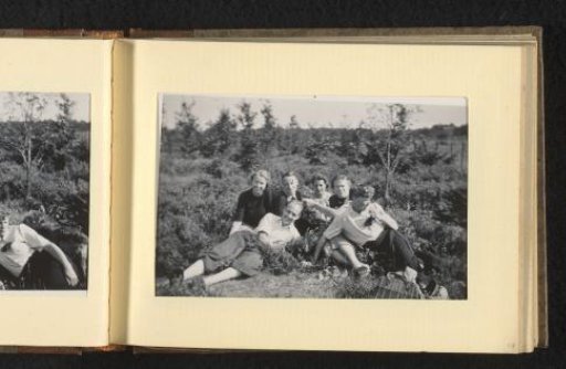 Four Women and Two Men Sitting in the Undergrowth