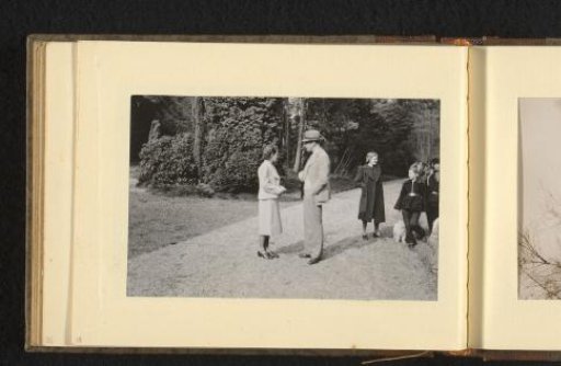 People on a gravel path in a garden