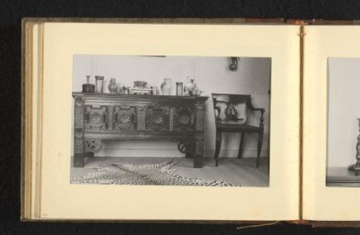 Interior with sideboard, panther skin, and chair